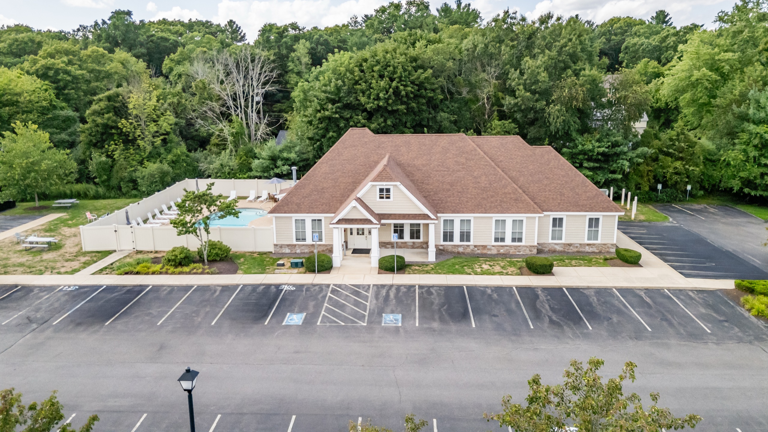 The Edgewood Apartments clubhouse and pool area from above.